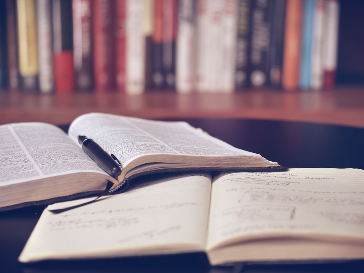 Two open books in warm light